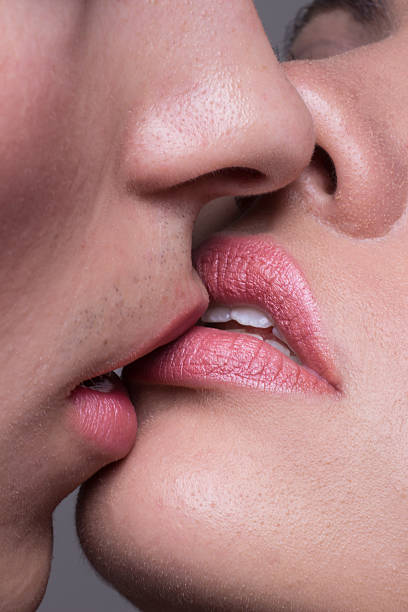 istock Close-up two lips kissing sensual intimate 603193788