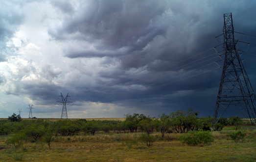 storm weather and clouds coming from the west - Texas landscape with power lines
