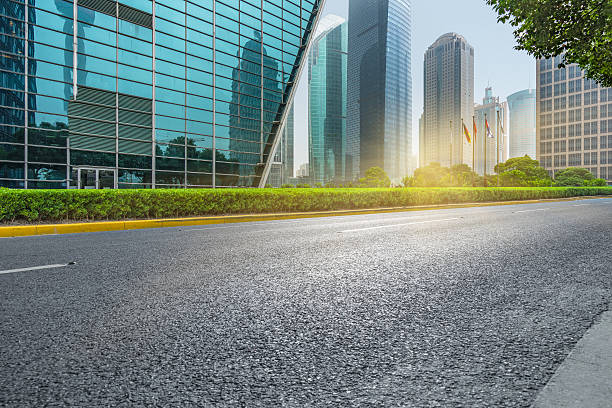 istock clean asphalt road with city skyline background 603199146