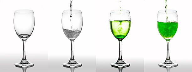 Pouring soft drink in glass and splash on white background. stock photo
