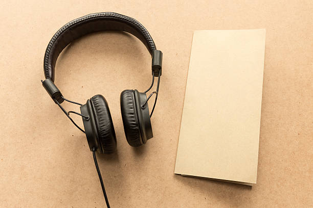 istock Headphone with brown paper note on wood desk. 603199178