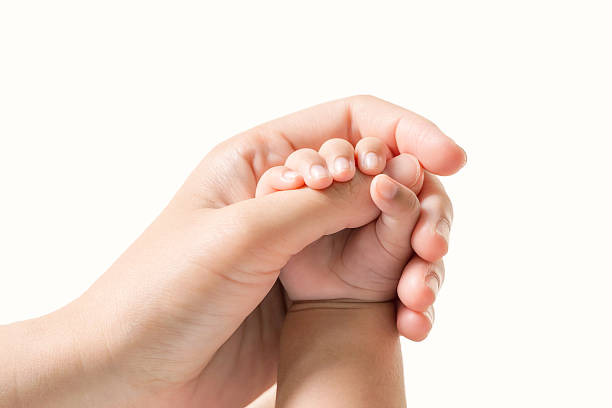 baby hand holding finger mom on isolated background. (selected focus) - newborn human hand baby father imagens e fotografias de stock