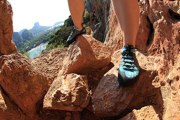 istock one young woman rock climber  on rock 603200226