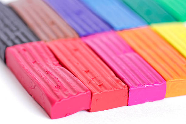 istock Colorful piece of plasticine or modeling clay on white background 603200332