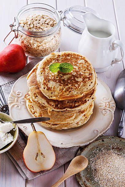 istock Pancakes over white wooden background 603252268