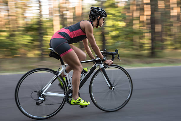 istock Athletic girl rides a bike 603252494