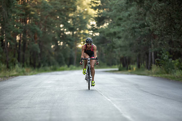 istock Athletic girl rides a bike 603252664