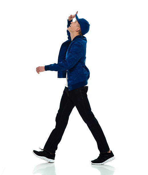 istock Smiling male walking and looking up 603252828