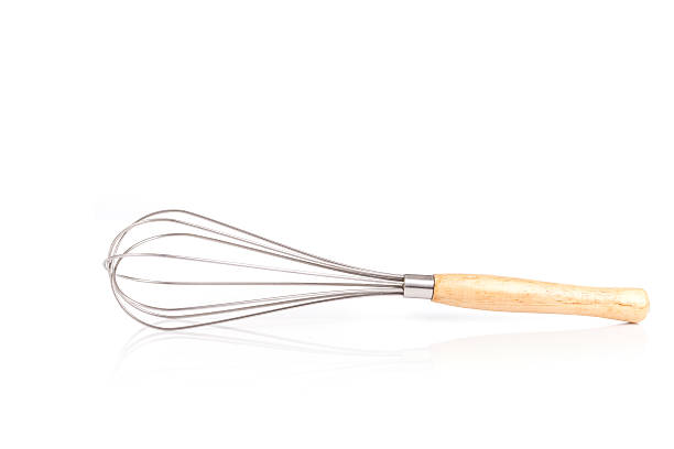 istock Close up stainless steel egg whisk isolated on white 603254060