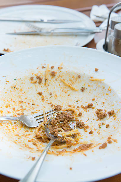 istock Dirty plate with knife and spoon on the table. 603254416