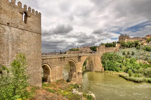The historical Puente de San MartÃ­n, or Saint Martin's brdge, across the river Tagus in Toledo, Spain