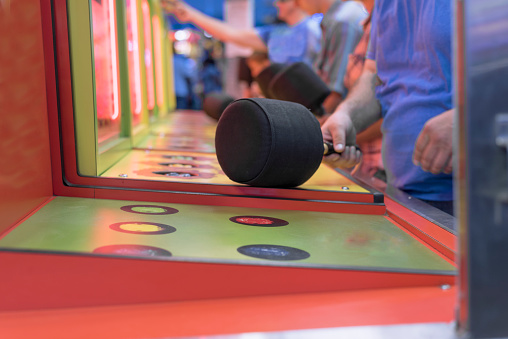 people preparing to play classic whack a mole game.