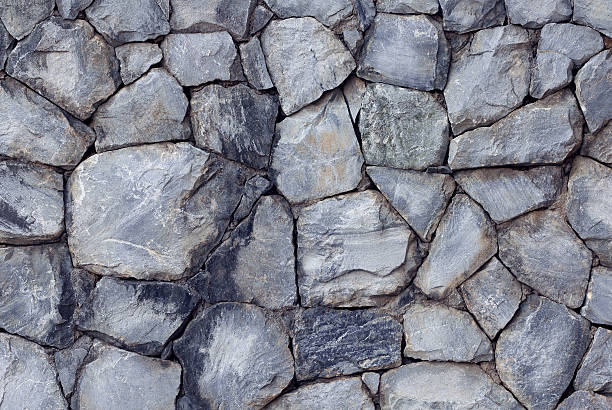 istock pattern gray color of cracked stone wall surface with cement 603256240