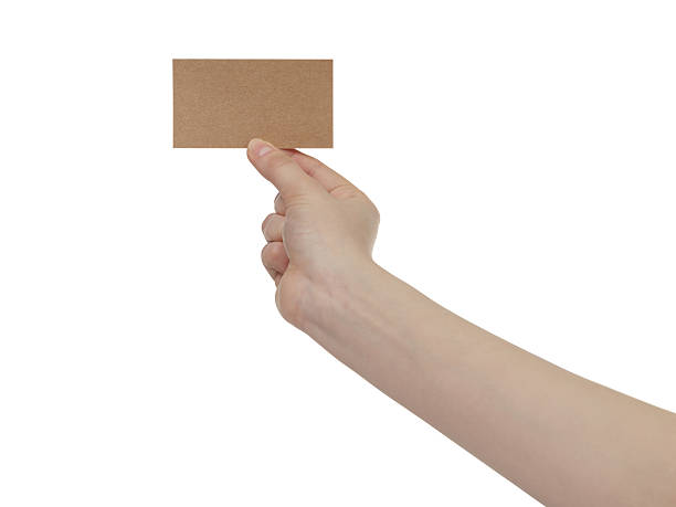 istock young female right hand hold blank brown paper card 603257090