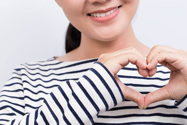 istock Woman show heart hands 603257774