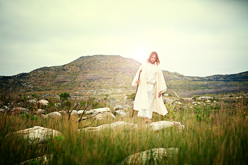 Shot of Jesus walking alone in the wilderness