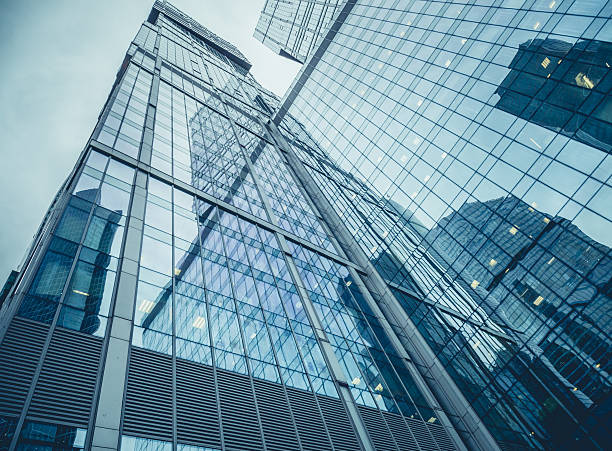 istock Modern facade of glass and steel reflecting sky 603260656