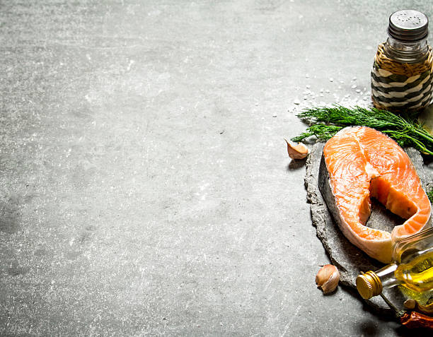istock piece of raw salmon with spices and herbs. . 603260784