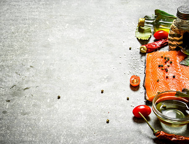 istock Salmon fillet with tomatoes, olive oil and spices. 603261076