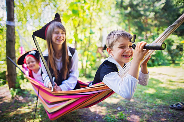 istock Kid pirates playing on a hammock boat 603261910