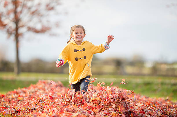 istock Joyfully Running Through a Pile of Leaves 603262508
