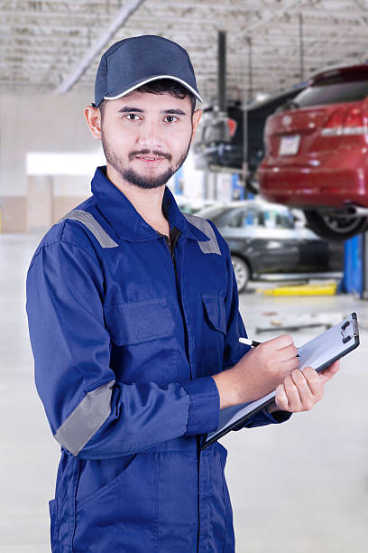 istock Arabic mechanic holds clipboard in workshop 603262690