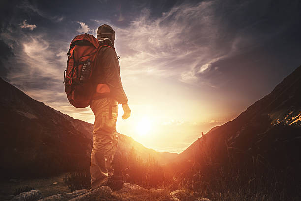 istock Traveler watching the sunset over the mountains 603263008