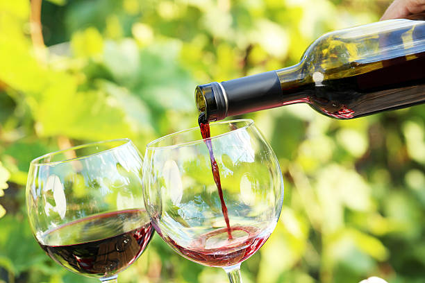 istock Pouring red wine into the glass 603263110
