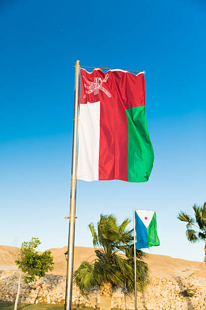 istock National flag of Oman on flagpole 603263508