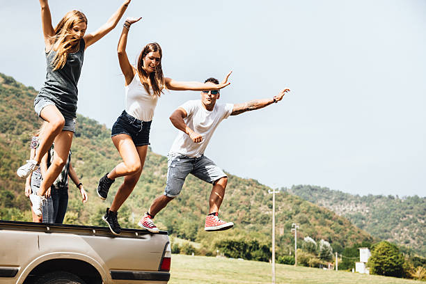 istock friends have fun on the van togetherness 603264094