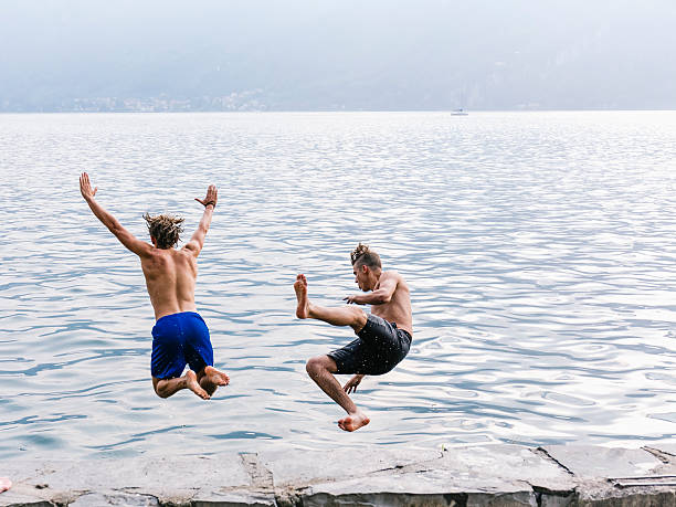 istock Two man diving in the water 603267934