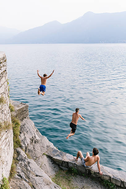 istock Two man diving in the water 603267944