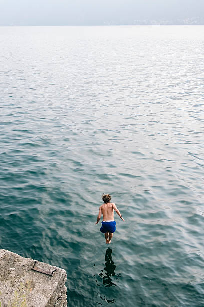istock Young man diving in the water. 603267946