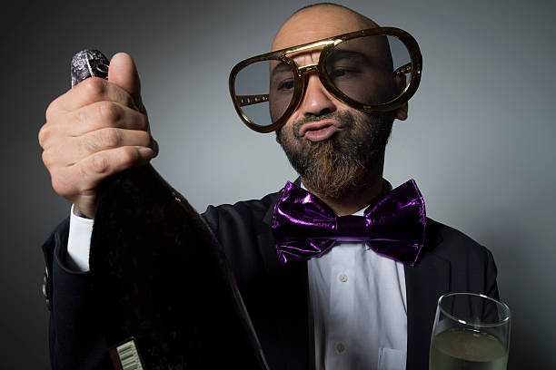 istock Man of sunglasses with champagne. 603268180