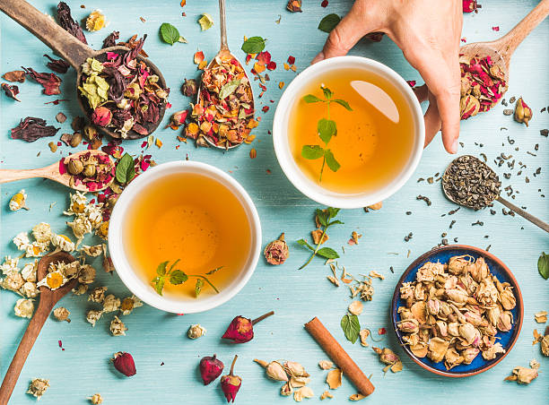 istock Two cups of healthy herbal tea with mint, cinnamon, dried 603268254