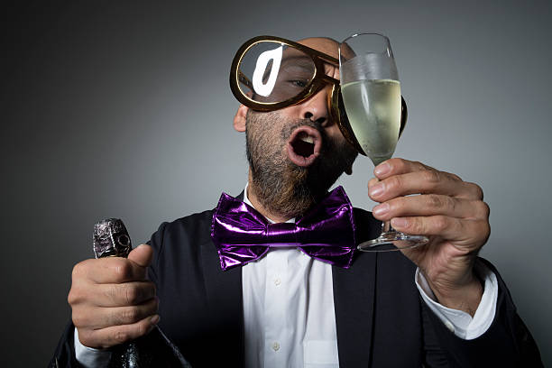 istock Sunglasses man is happy with a champagne glass. 603268564