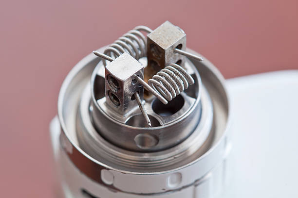 New clapton coil mounted in the electronic cigarette stock photo