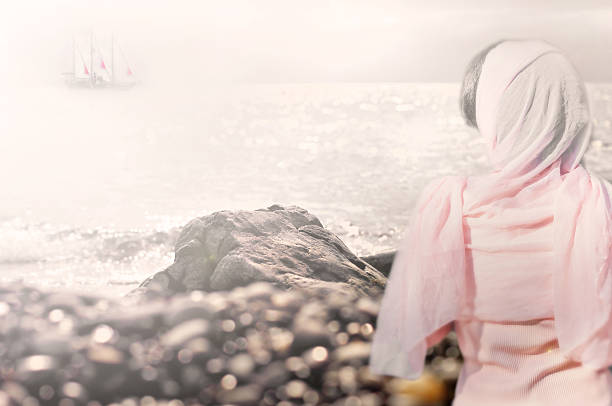 Ship with scarlet sails on horizon and girl in pink scarf from back