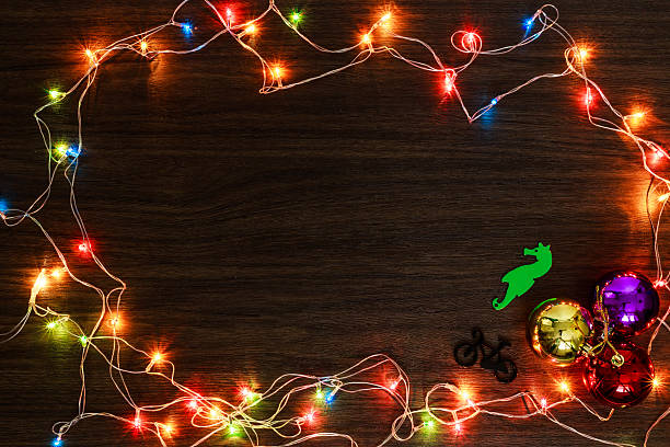 istock colorful light on wood texture for christmas 603272504