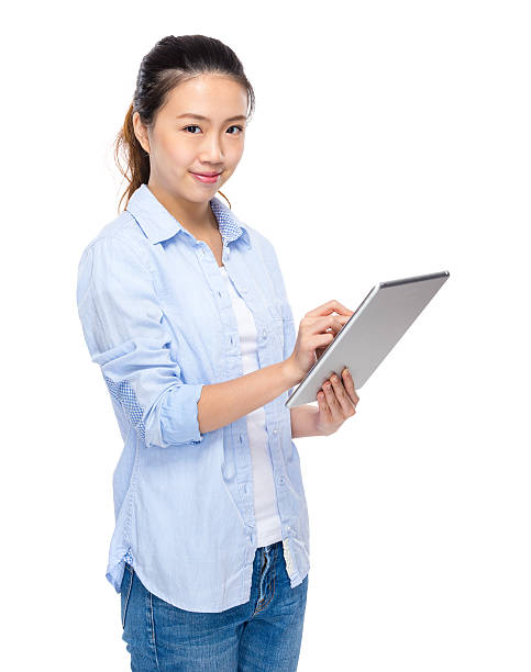 istock Chinese woman holding a tablet 603273808