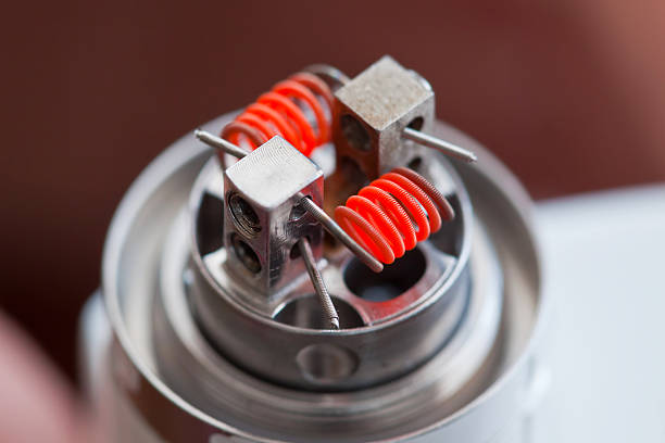 Preheat spiral of clapton coil mounted in the electronic cigarette stock photo