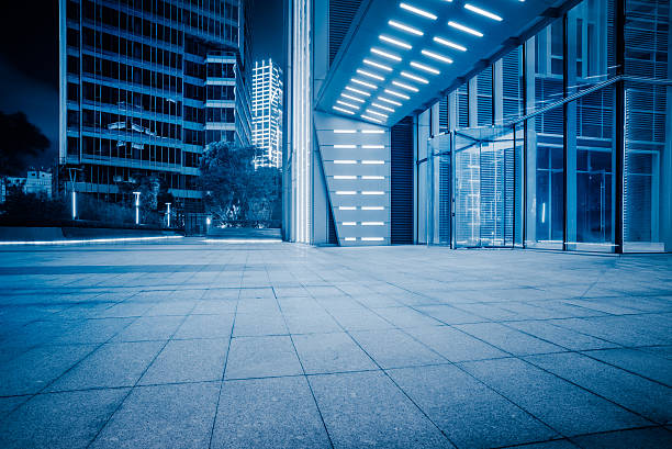 istock night view of empty brick floor front of modern building 603275924