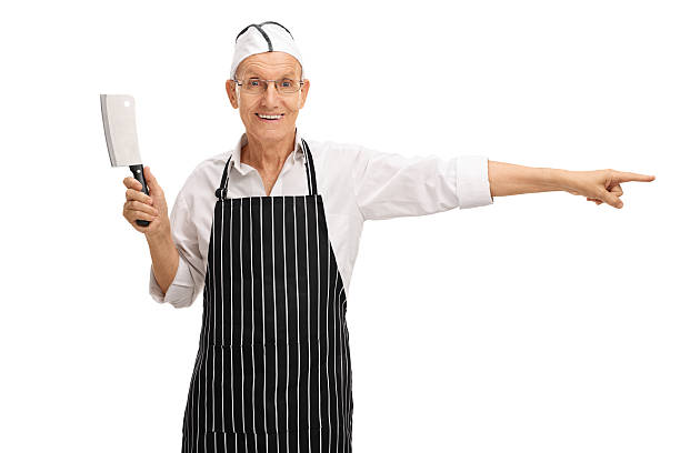 istock Butcher holding a cleaver and pointing 603276506