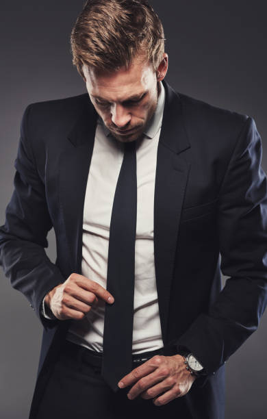 Suits Complete The Man Stock Photo - Download Image Now - Handsome People,  Shoulder Pad, Adjusting - iStock