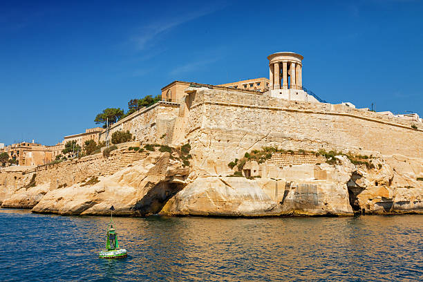 istock Sunny view of Siege Bell War Monument from the sea. 603279930