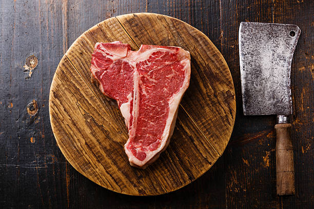 istock Raw meat T-bone steak and cleaver 603282016