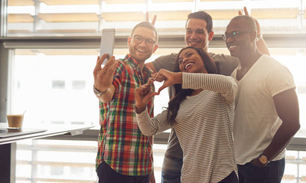 istock Silly employees taking self portrait 603282366
