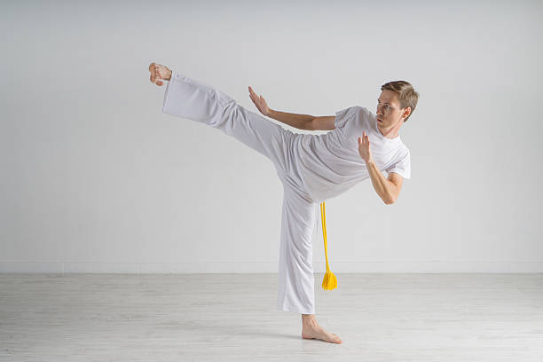 istock Man in sportswear performing a kick. 603282516