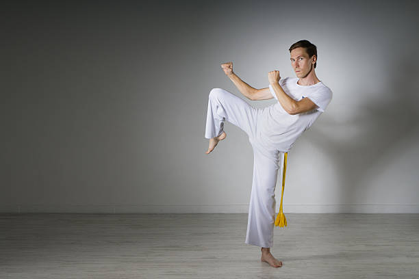 istock Man in sportswear performing a kick. 603282758