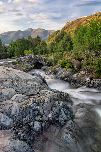 istock Ashness Bridge in the Lake District with mountains in background. 603284556